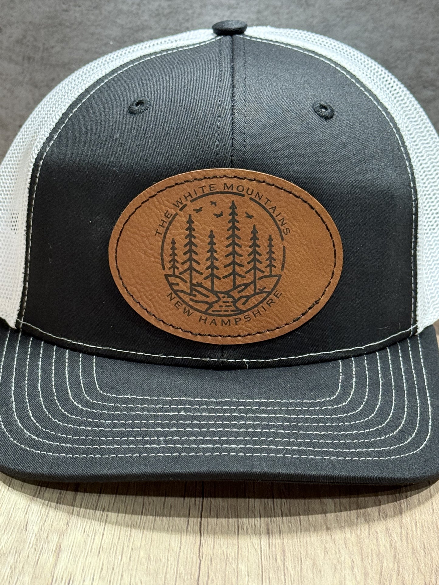 The White Mountains of New Hampshire Engraved Patch Trucker Hat