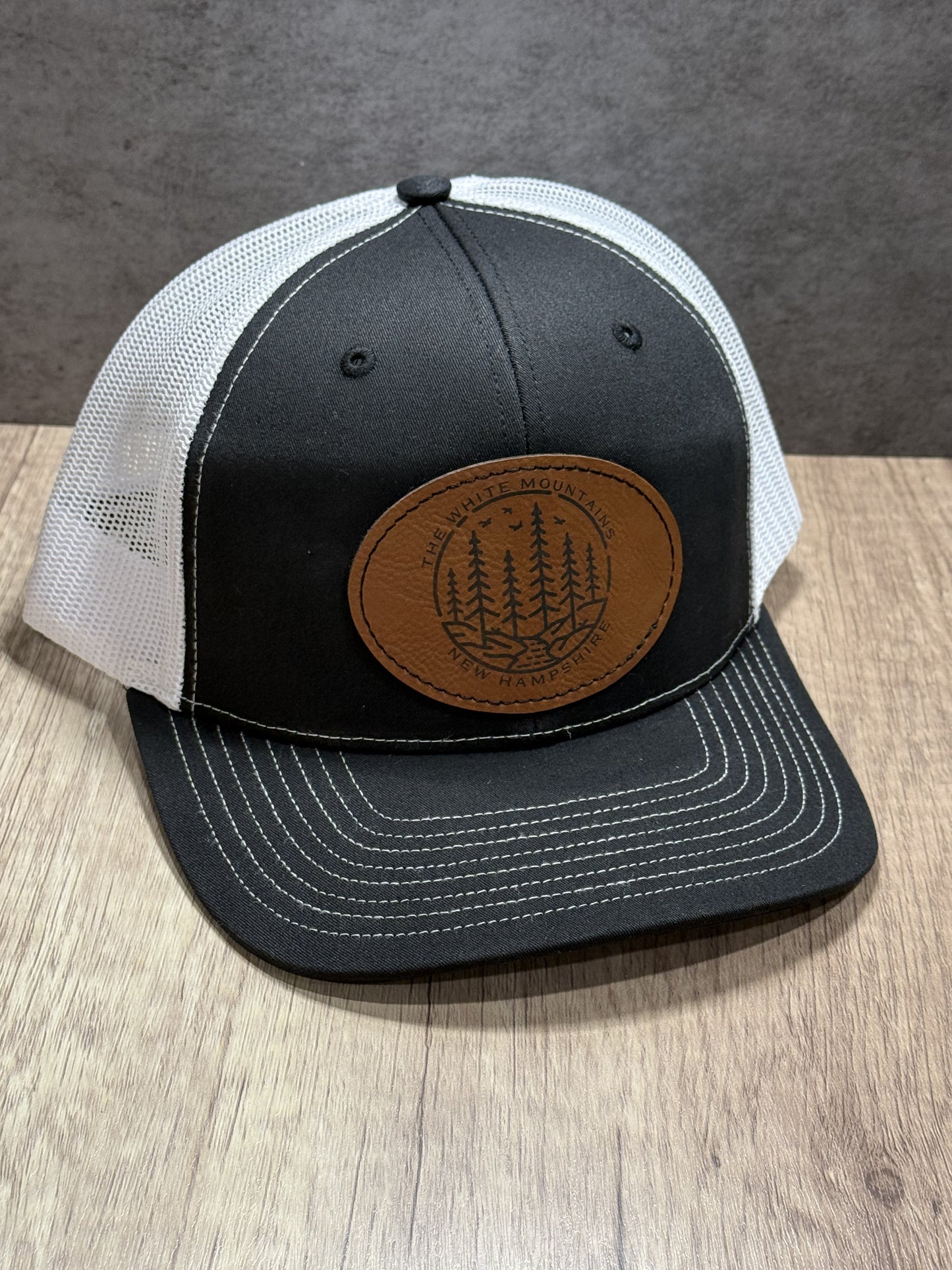 The White Mountains of New Hampshire Engraved Patch Trucker Hat