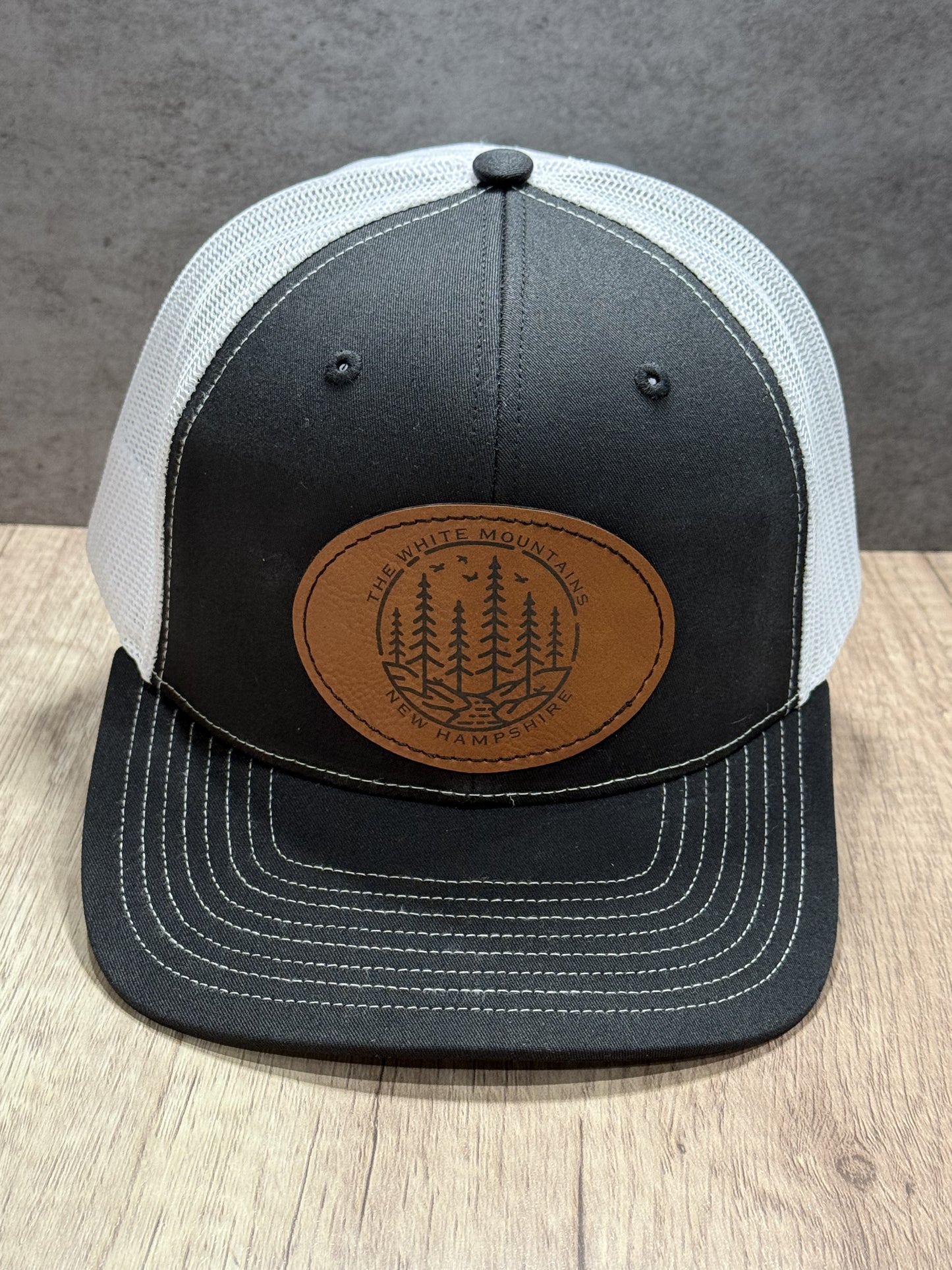 The White Mountains of New Hampshire Engraved Patch Trucker Hat